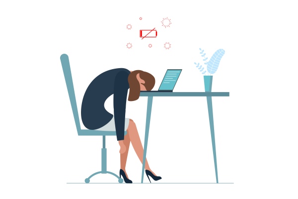 Femme en burnout sur son bureau